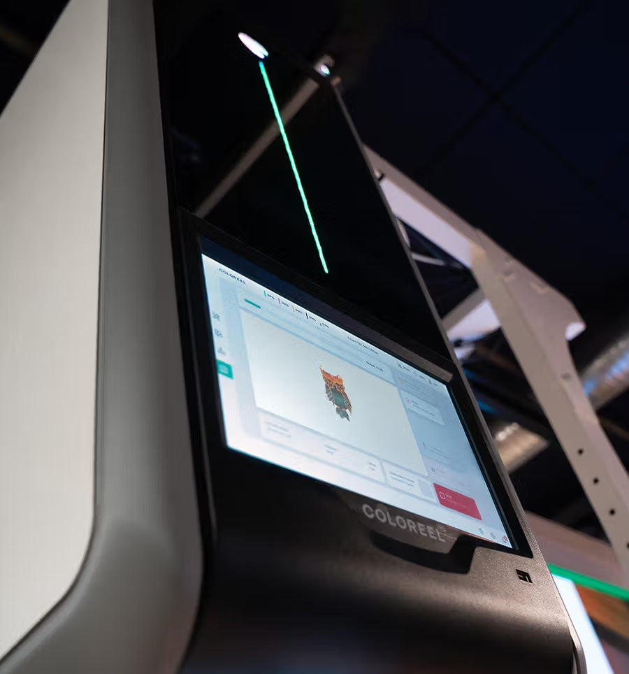 The Coloreel touchscreen interface with live thread coloring