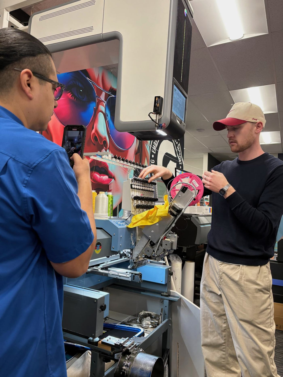 A Coloreel instant thread-colouring unit mounted on a ZSK Sprint embroidery machine at Garment Printer's Santa Fe Springs showroom